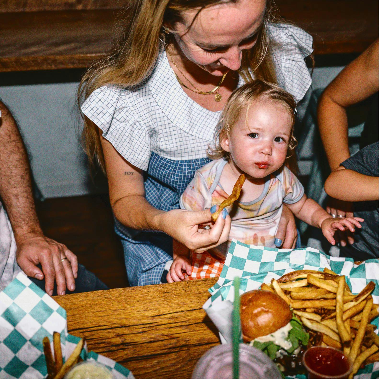 Mom and kid eating fries